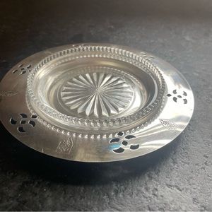 Vintage silver-plated item with a glass insert wine bottle coaster.